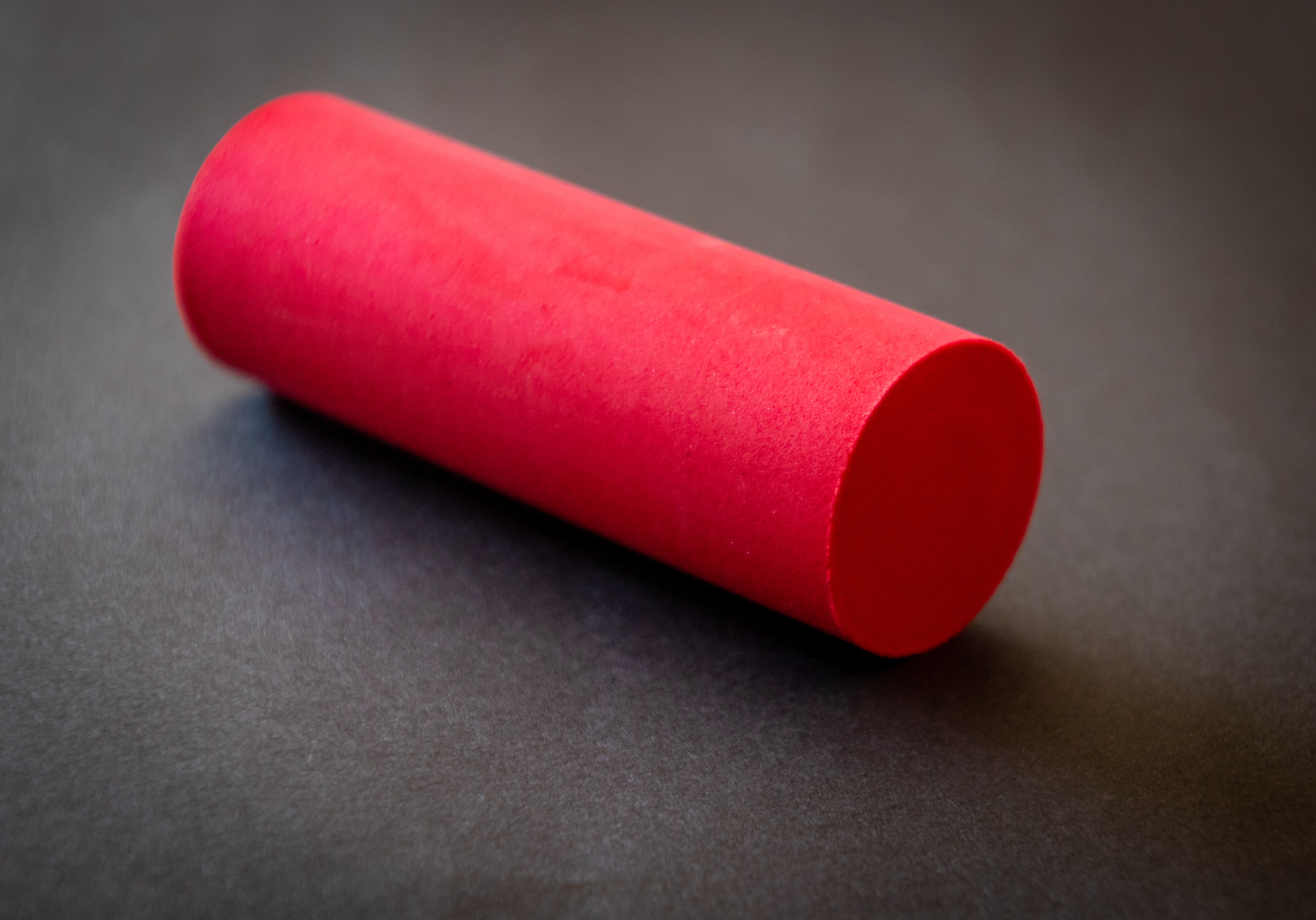 A photo of a piece of red chalk