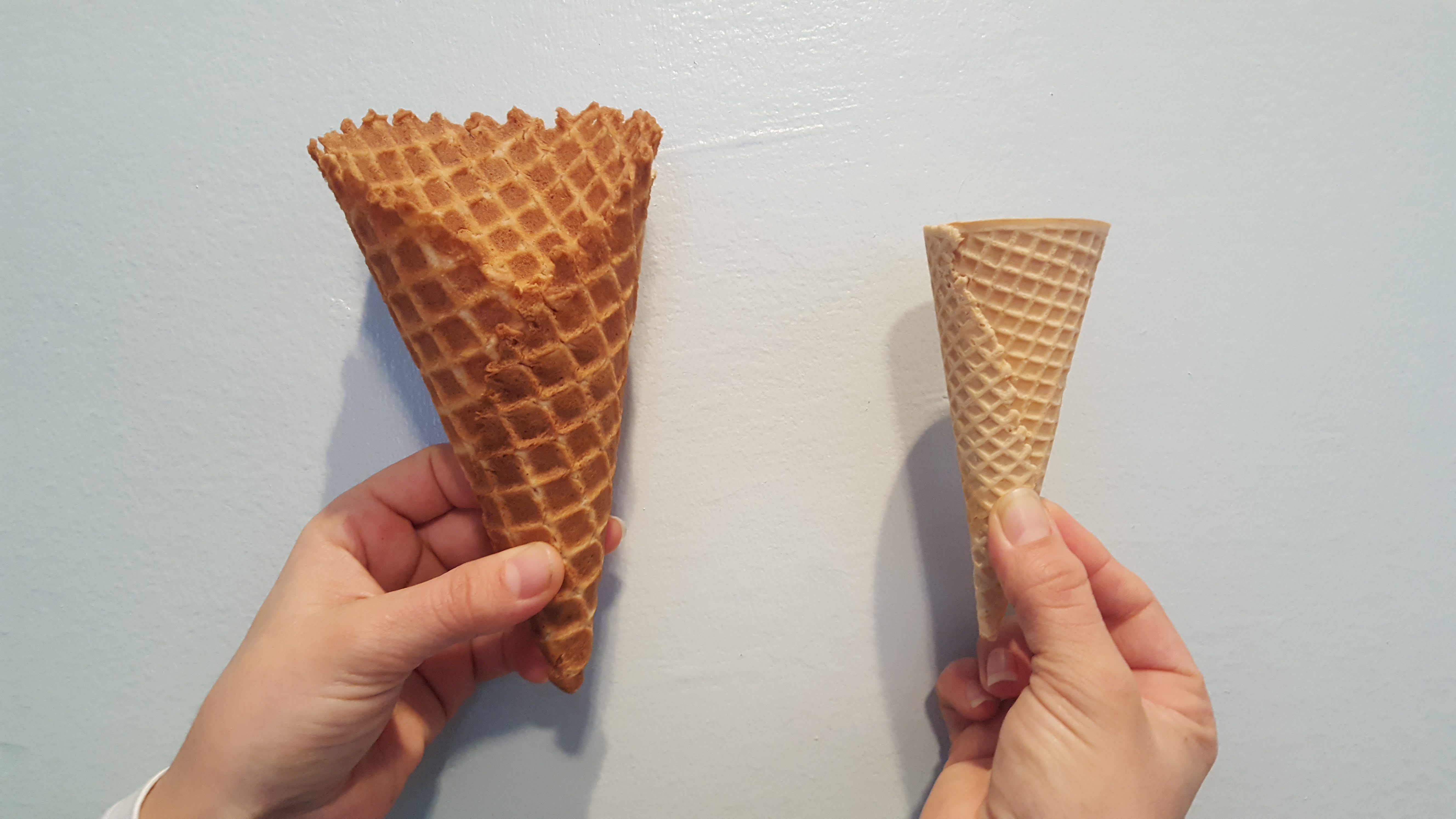 Photo of two different ice-cream cones.