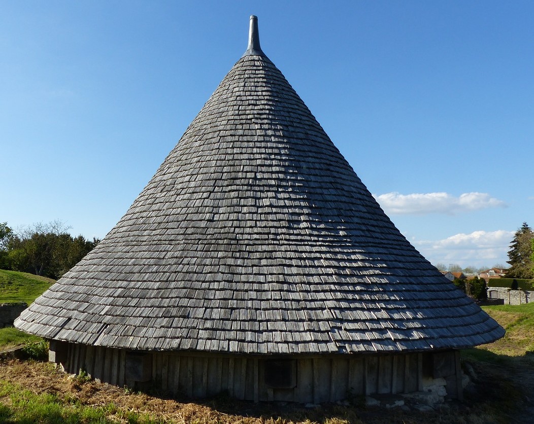 A photo of a structure with a conical roof
