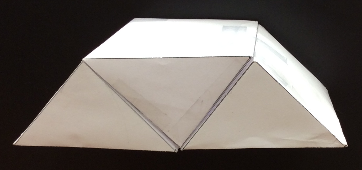 A photo graph of paper prisms stacked.