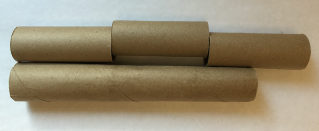 3 short cardboard tubes lined up horizontally. 1 long cardboard tube below. Long tube starts at the same spot as the first short tube and ends about half way down the third short tube.