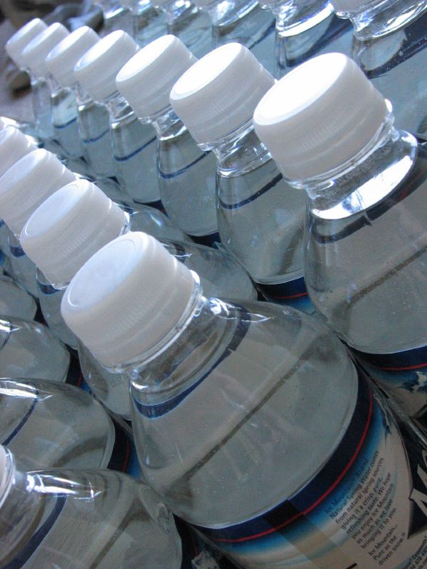 A photograph of water bottles arranged in rows.