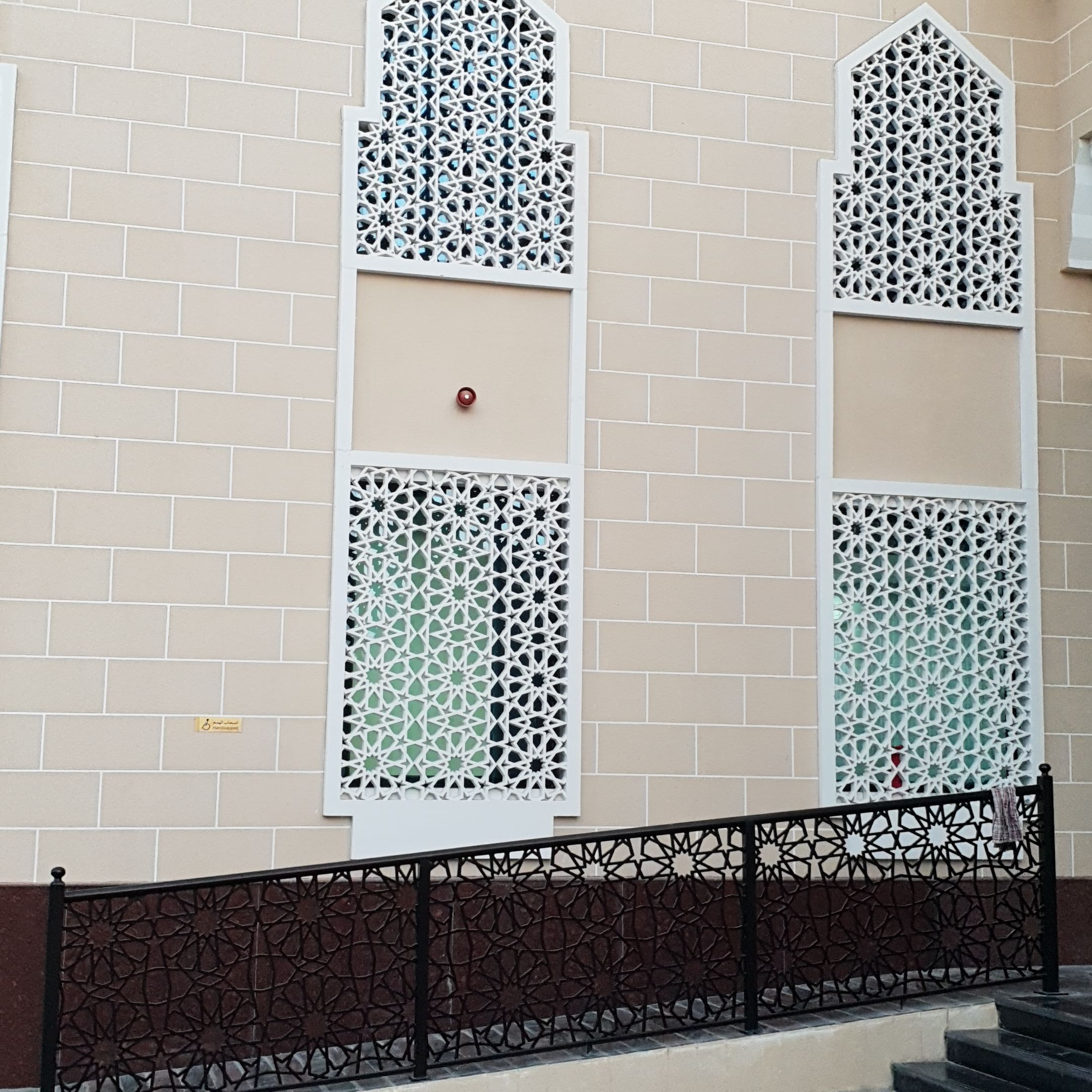 Geometric star patterns on fencing and window coverings.