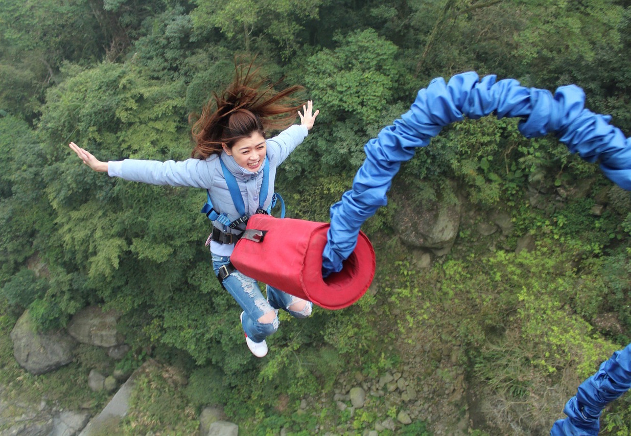 Woman bungee jumping.