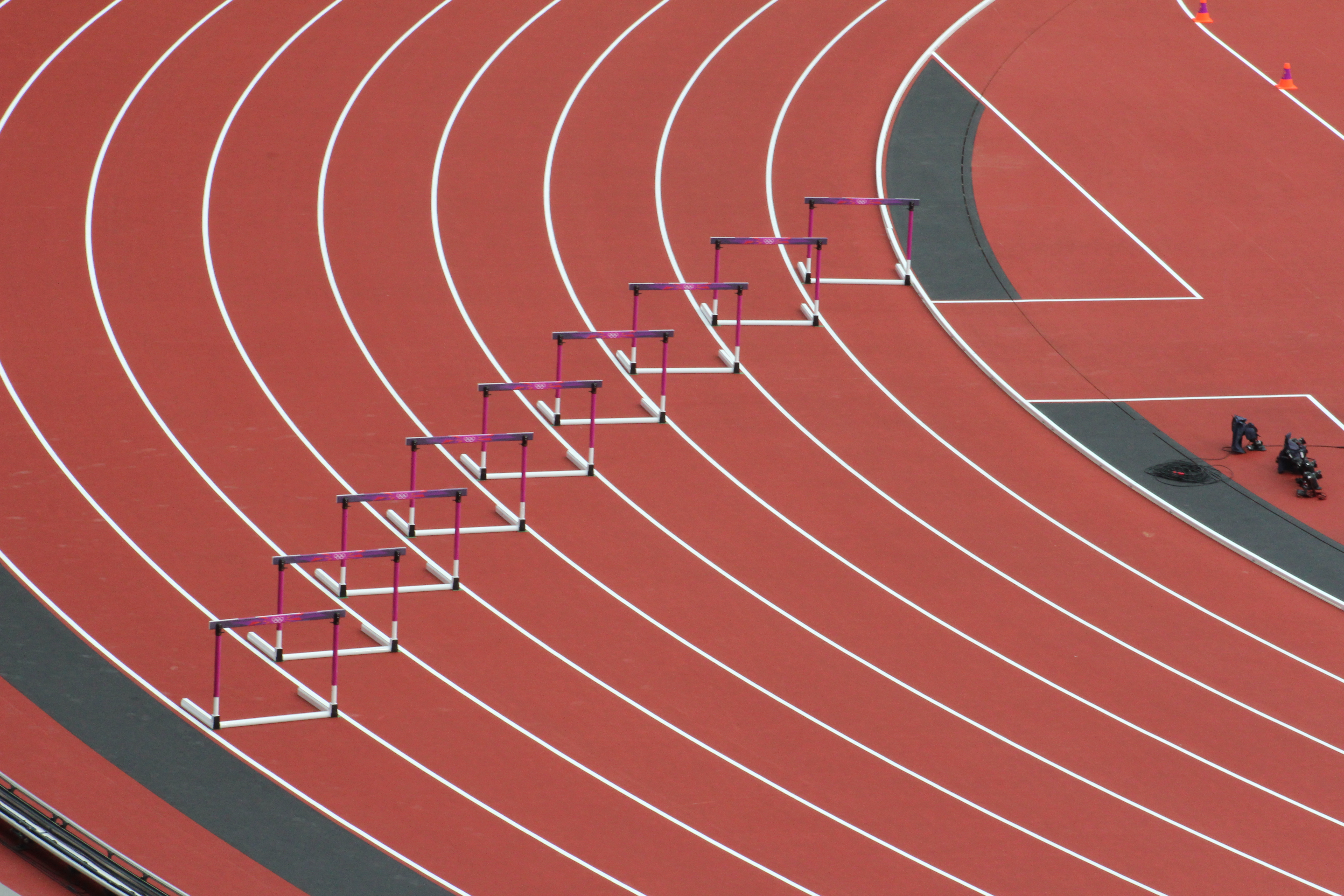 photo of empty track with hurdles