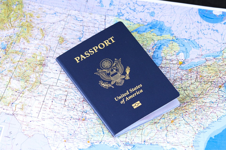 US passport on world map background