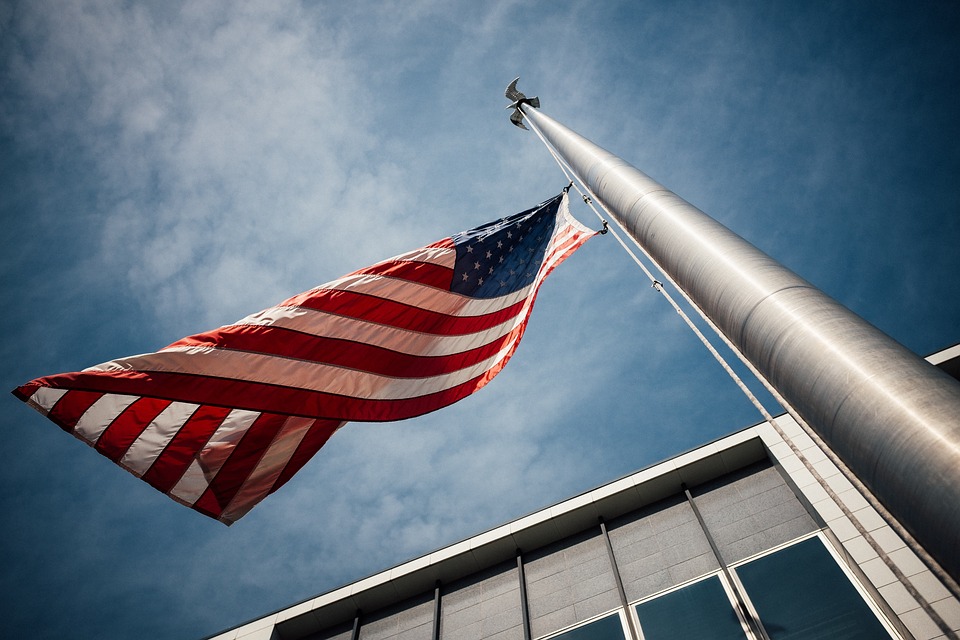 a US flag being raised