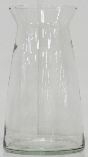 Photo of a glass vase. The sides are not perpendicular, instead tilting in until just before the top of the vase and then tilting back out to end almost directly above the edge of the base.