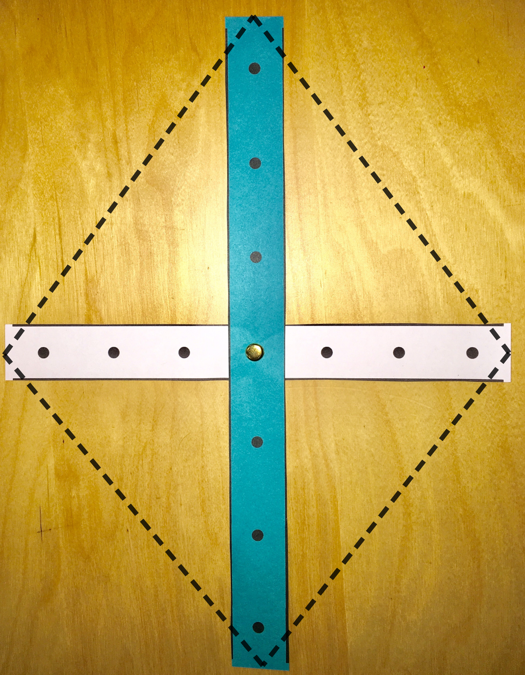 Picture of strips making a cross to form a kite.