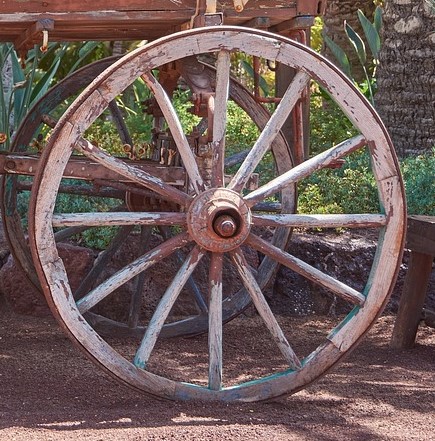 A photo of an old wagon wheel