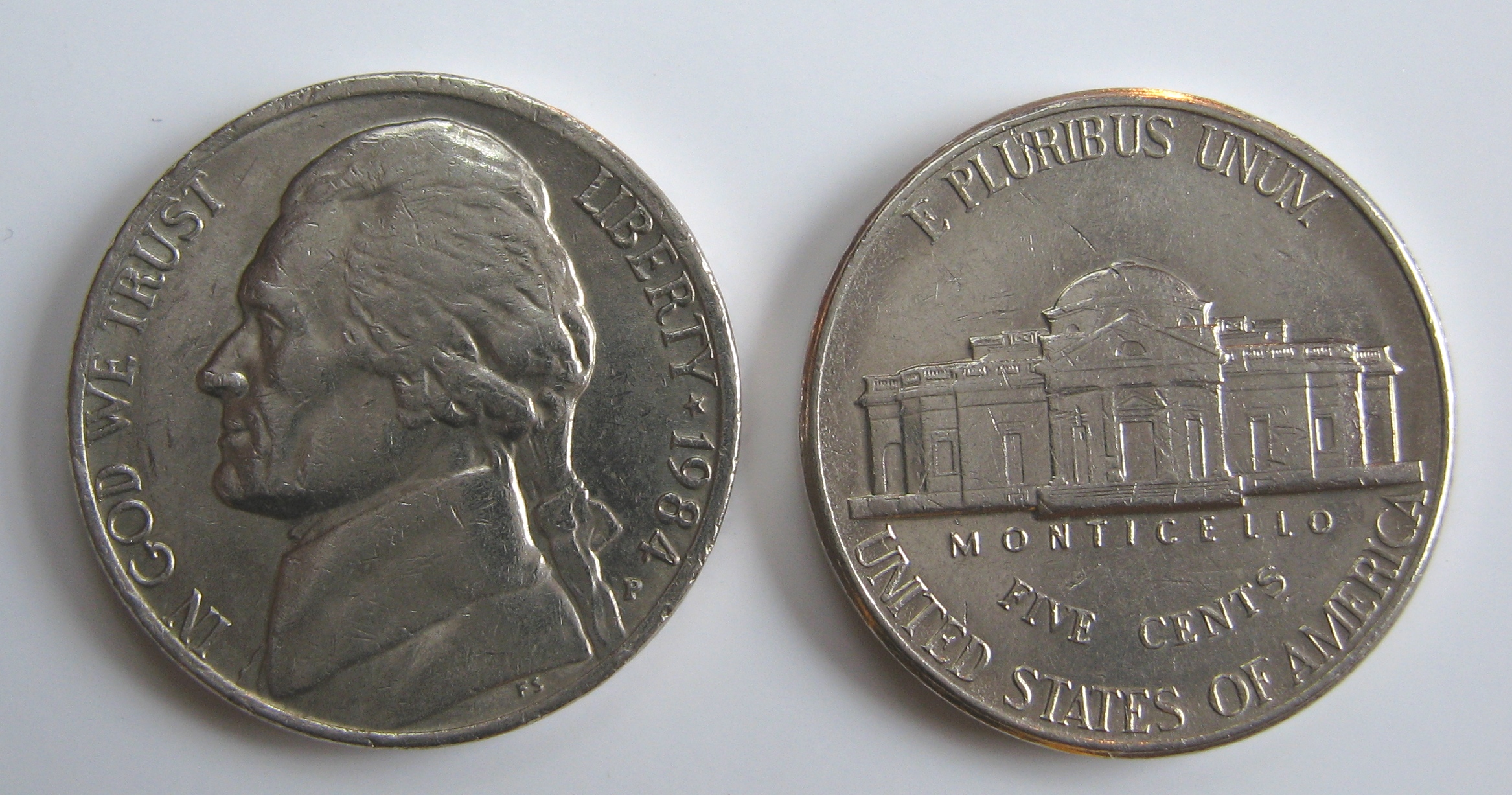 photo of a nickel showing both the heads and tails sides