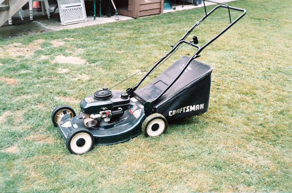 A lawnmower on a lawn.