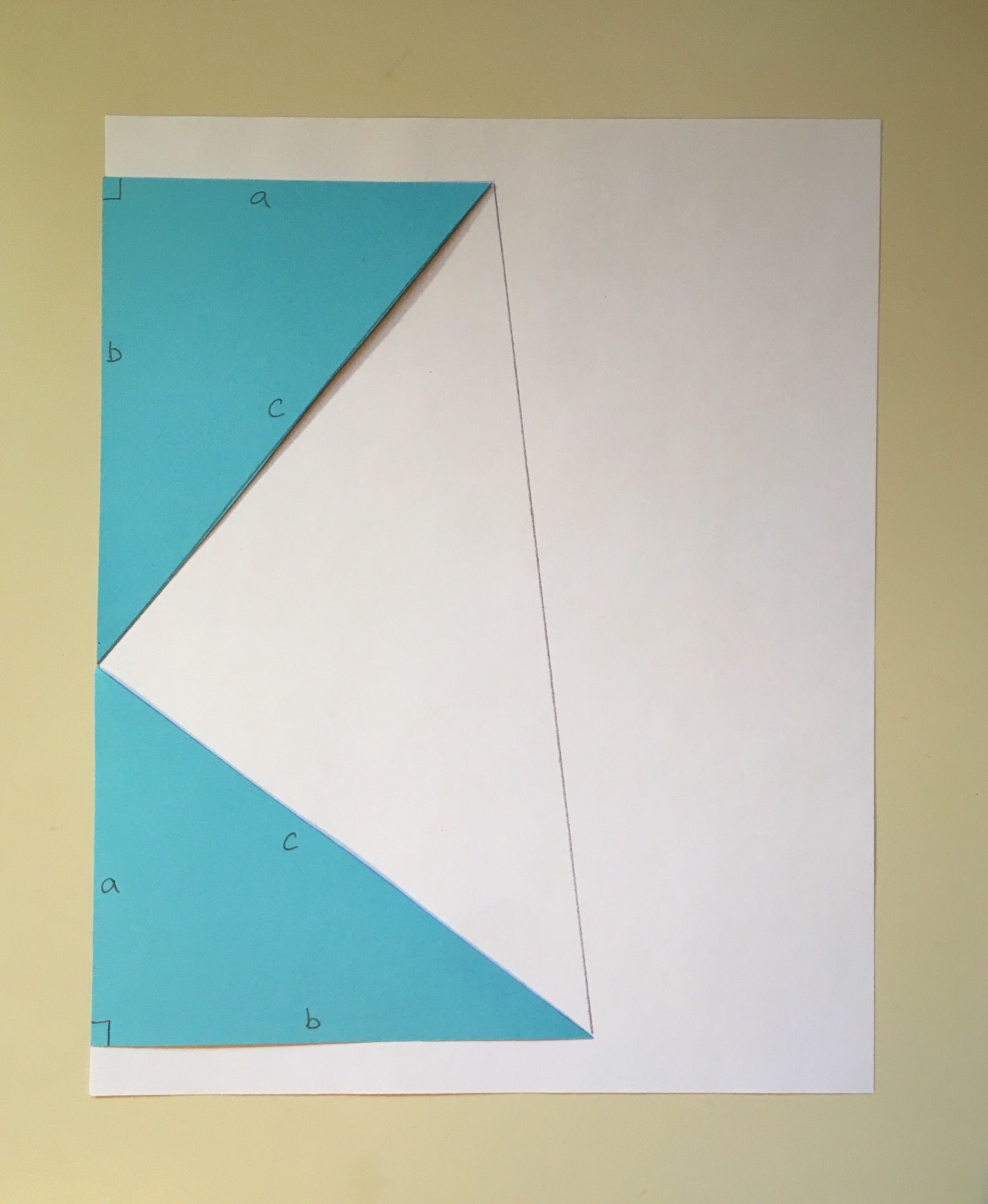 Diagram with 2 paper triangles.